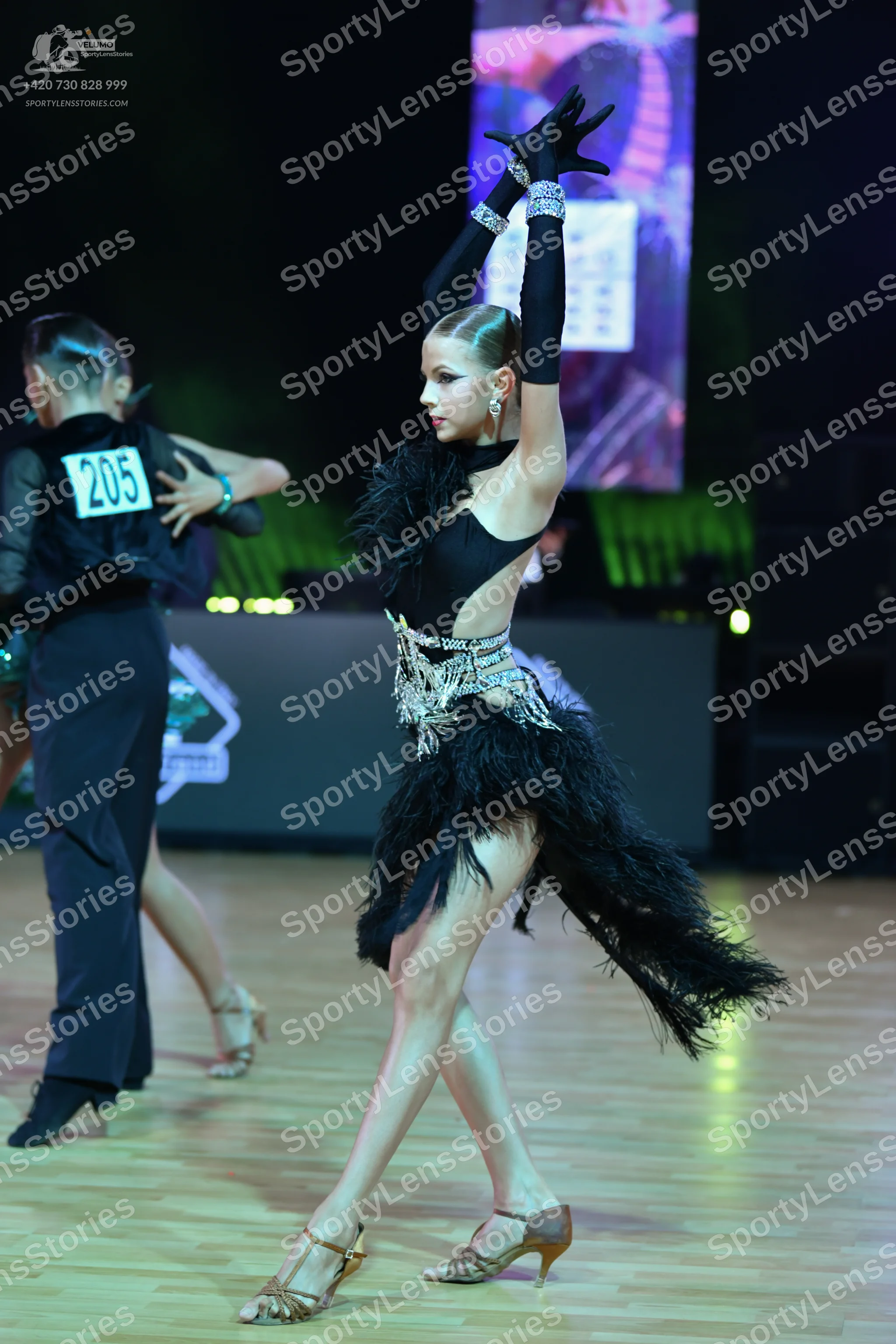 Dancesport competitor: Male dancer: black long-sleeved top and black trousers