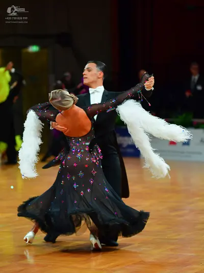Dancesport competitor: Male dancer: black tailcoat, white shirt, and white bow tie