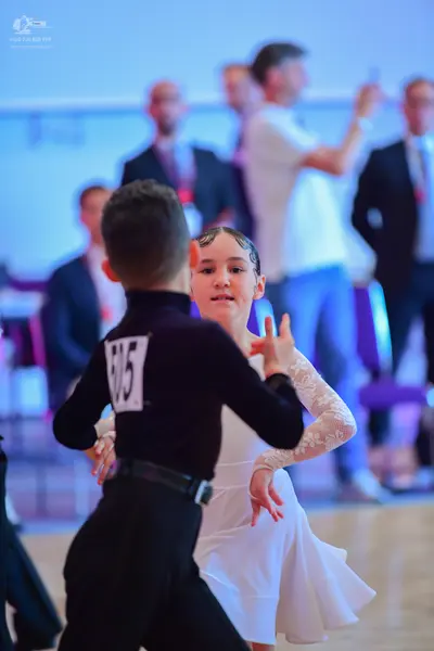 Dancesport competitor #605: Male dancer: black long-sleeved top and black trousers with a black belt
