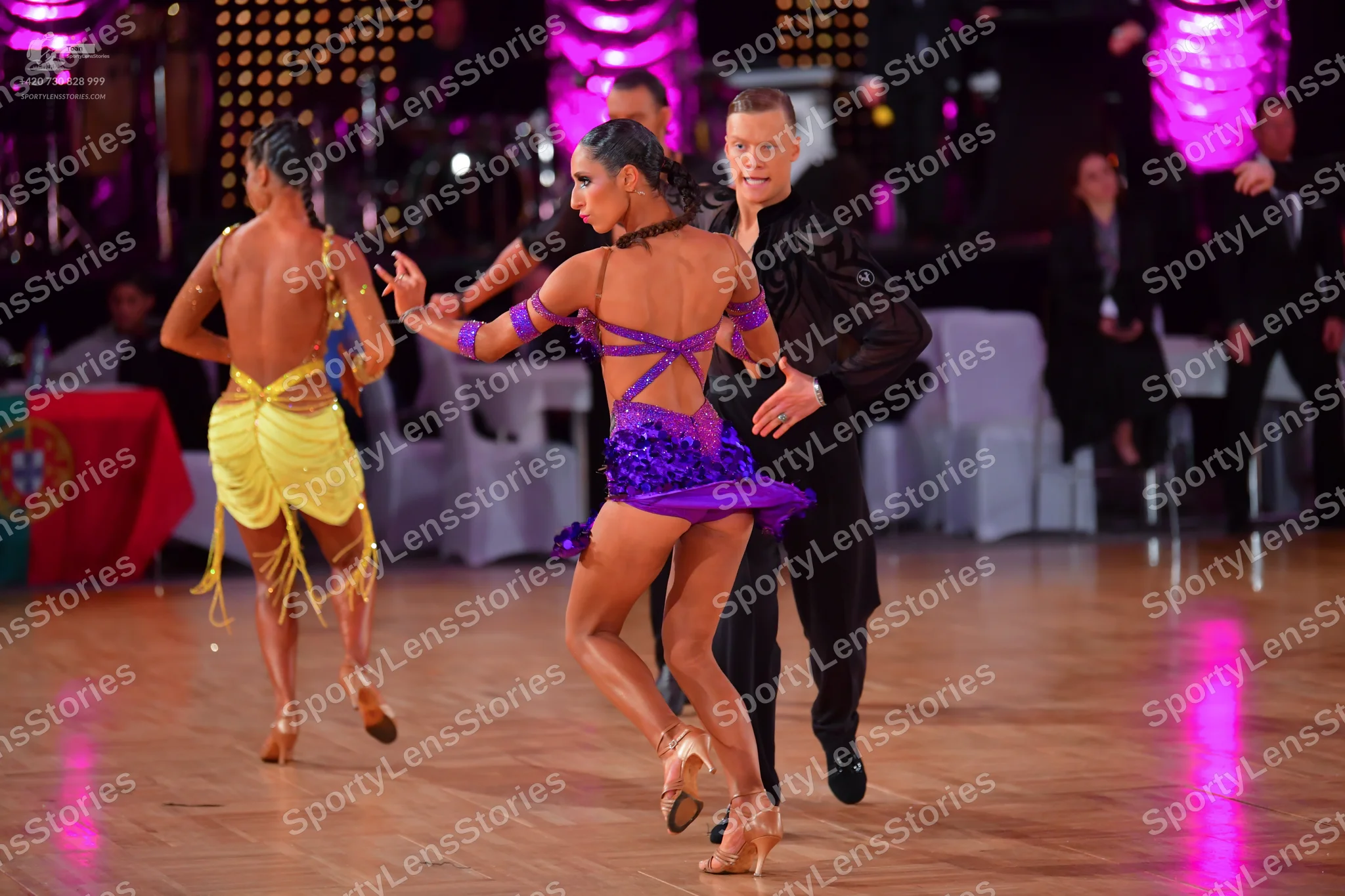 Dancesport competitor: Female dancer: yellow Latin costume with fringe