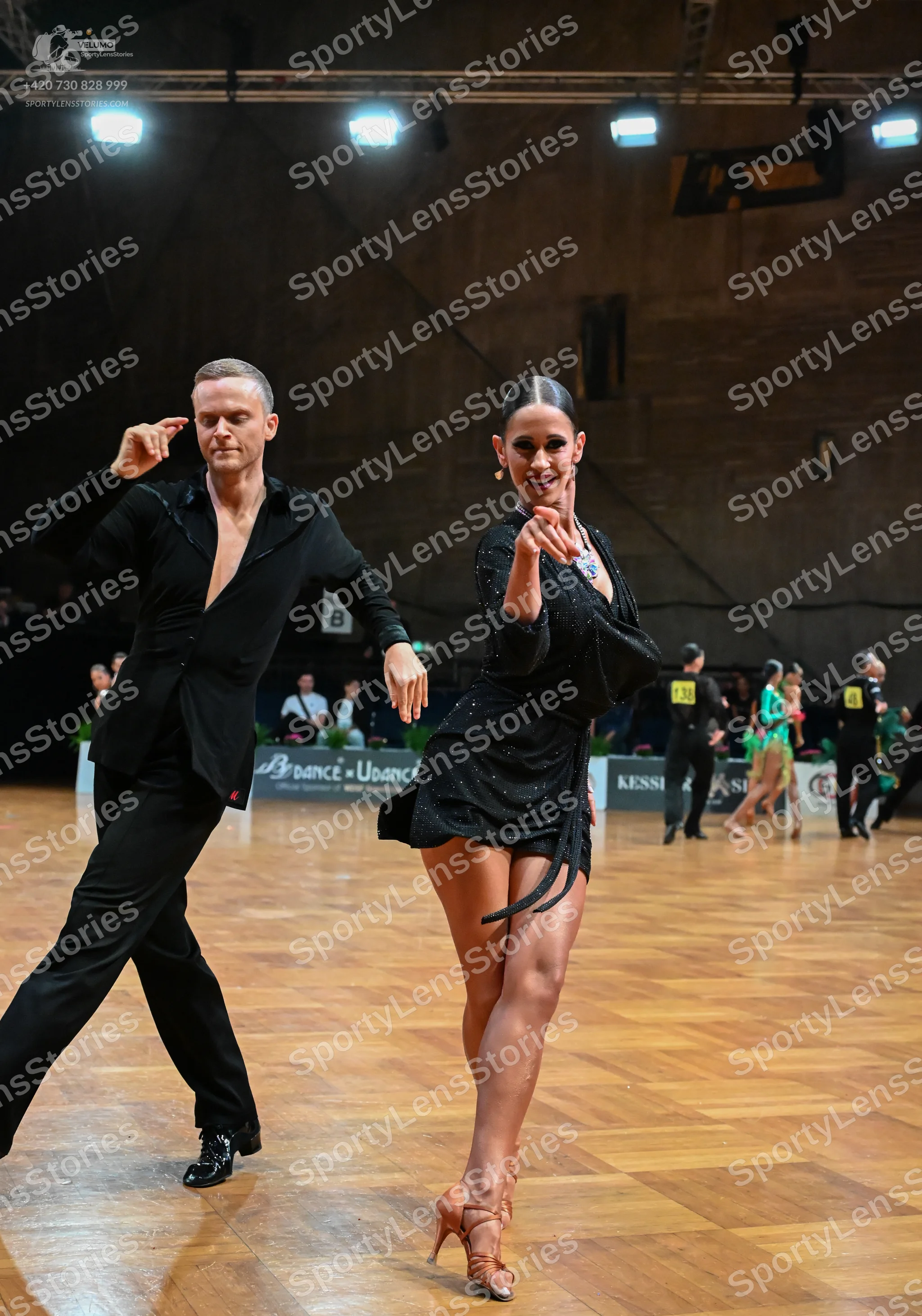 Dancesport competitor #44: Male dancer: black long-sleeved shirt and black trousers