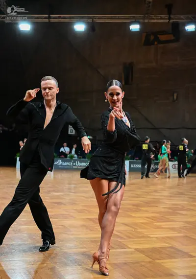 Dancesport competitor #44: Male dancer: black long-sleeved shirt and black trousers