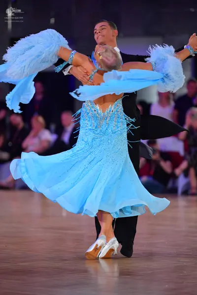 Dancesport competitor: Male dancer: black formal suit
