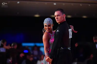 Dancesport competitor #11: Male dancer: black long-sleeved shirt and black trousers