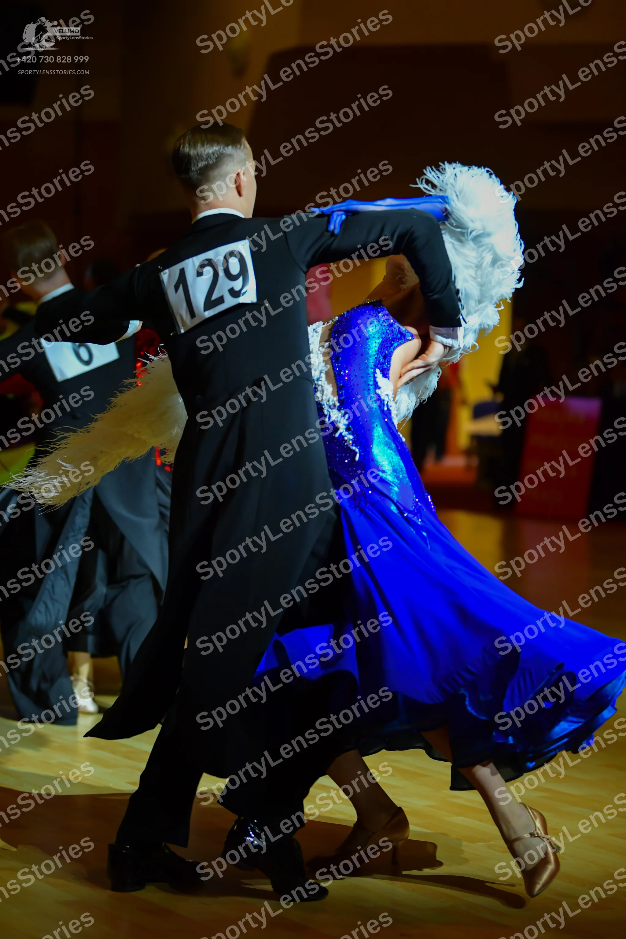 Dancesport competitor: ** Black tail suit with silver sequin lapels