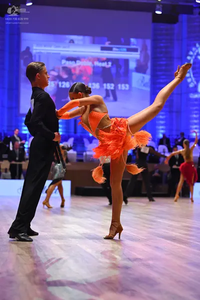 Dancesport competitor: Male dancer: black long-sleeved dance shirt and black trousers