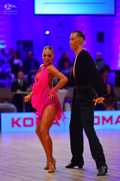 Dancesport competitor: Male dancer: black long-sleeved top and trousers