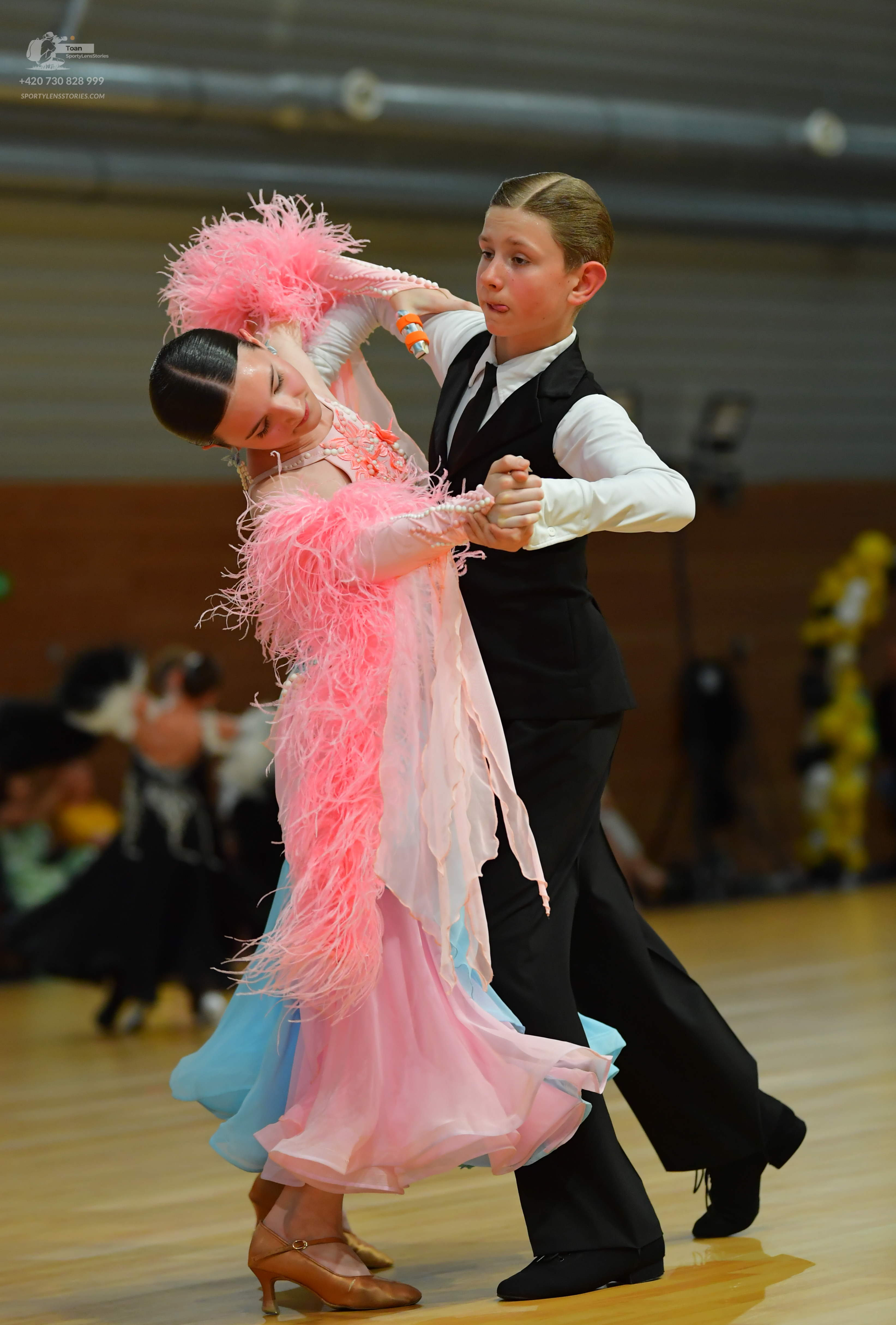 Dancesport competitor: Male**
*   **Color:** Black
*   **Fabric:** Tail suit with sequin lapels