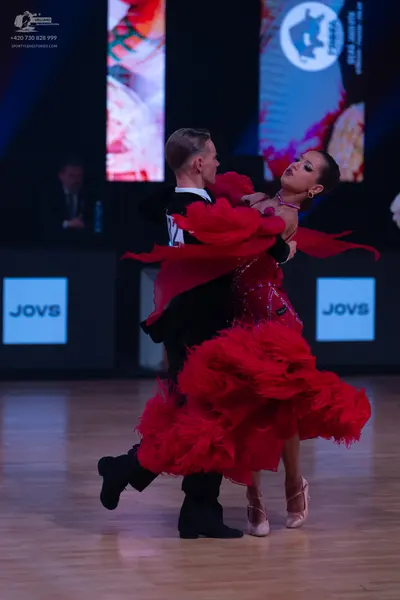 Dancesport competitor: Male dancer: black dance outfit with black trousers