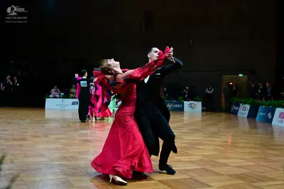 Dancesport competitor #128: Male dancer: black suit with a white shirt and black bow tie