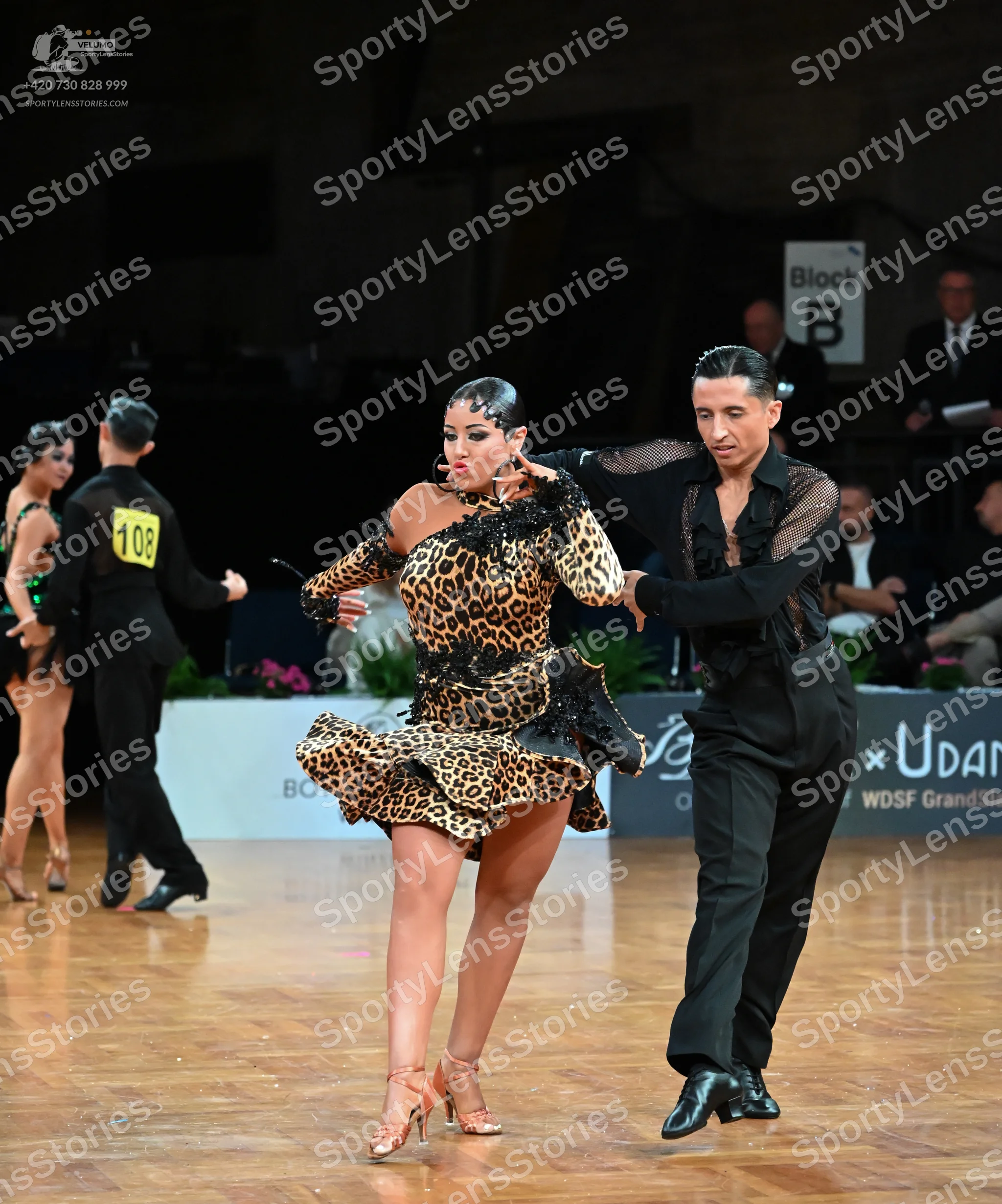 Dancesport competitor #108: Male dancer (left): black suit