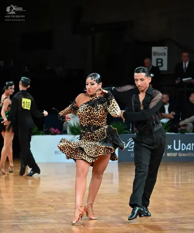 Dancesport competitor #108: Male dancer (left): black suit