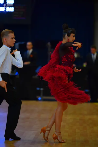 Dancesport competitor: Male dancer: white long-sleeved shirt and black trousers