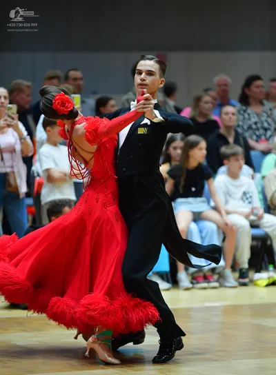 Dancesport competitor: Male dancer: black suit with a white shirt