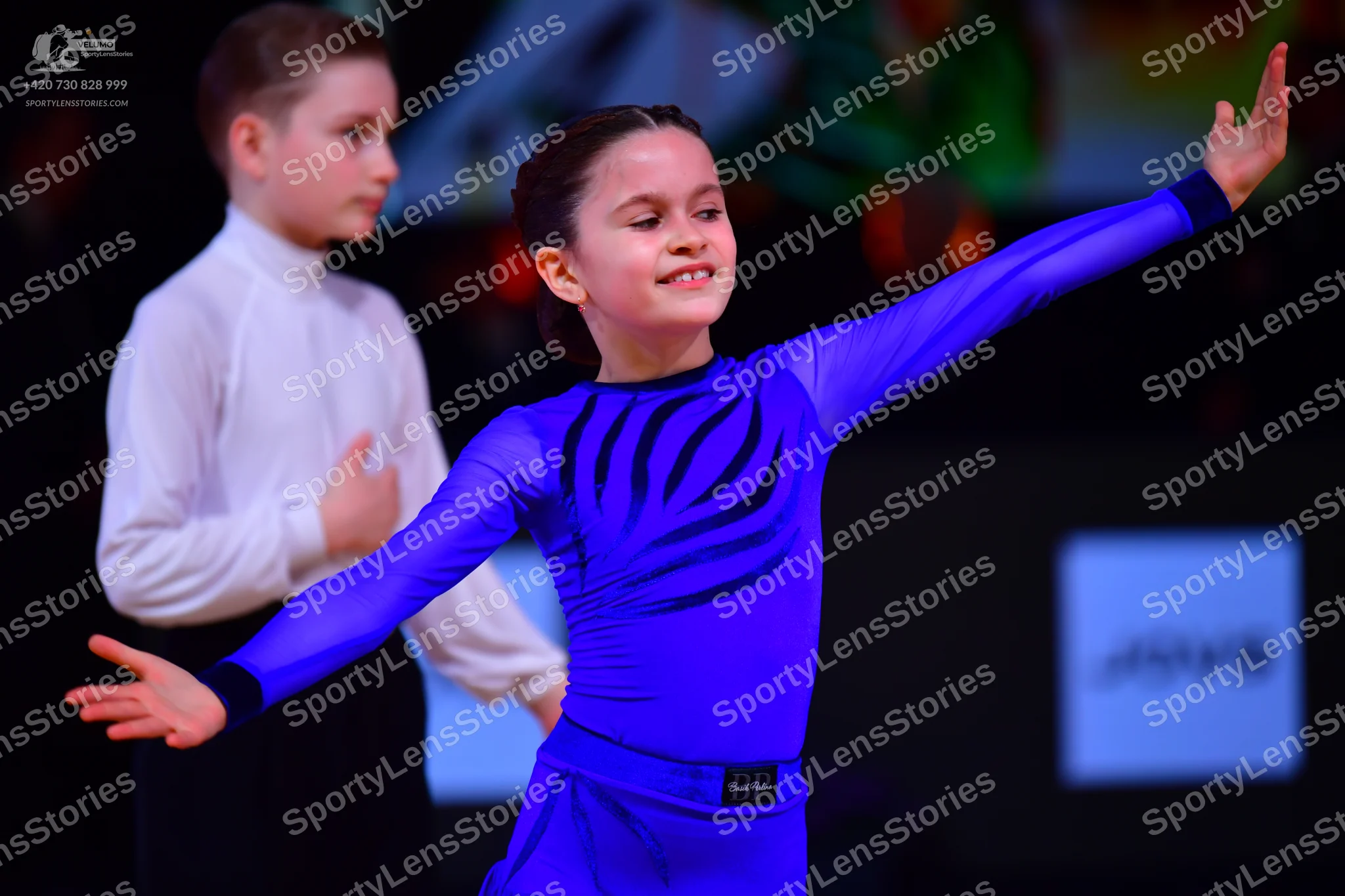 Dancesport competitor: Male dancer: white long-sleeved shirt and black trousers