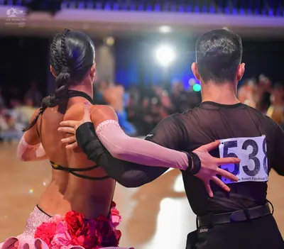Dancesport competitor #538: Male dancer: black tight-fitting shirt and black trousers with a black belt