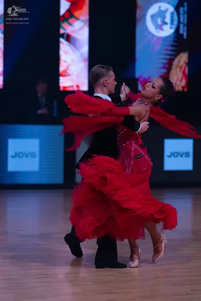 Dancesport competitor: Male dancer: black suit