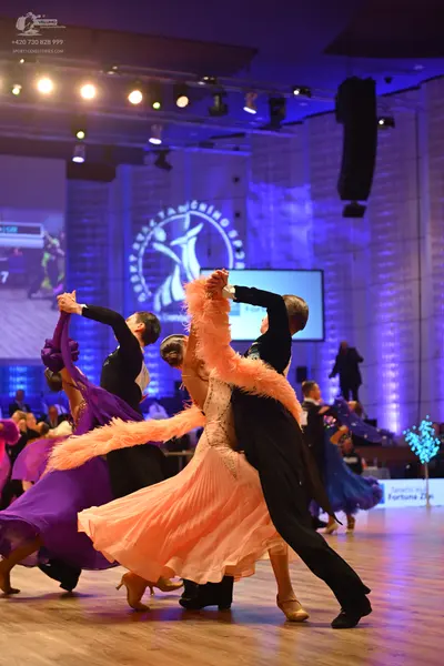 Dancesport competitor: Male dancer (right): black suit