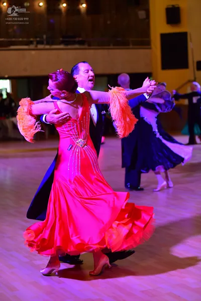 Dancesport competitor: ** Red Latin dress with a very full, flowing skirt