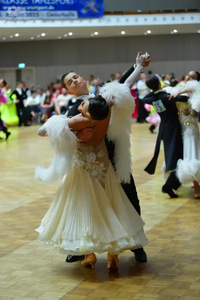 Dancesport competitor #75: Male dancer: black suit with white shirt and white bow tie