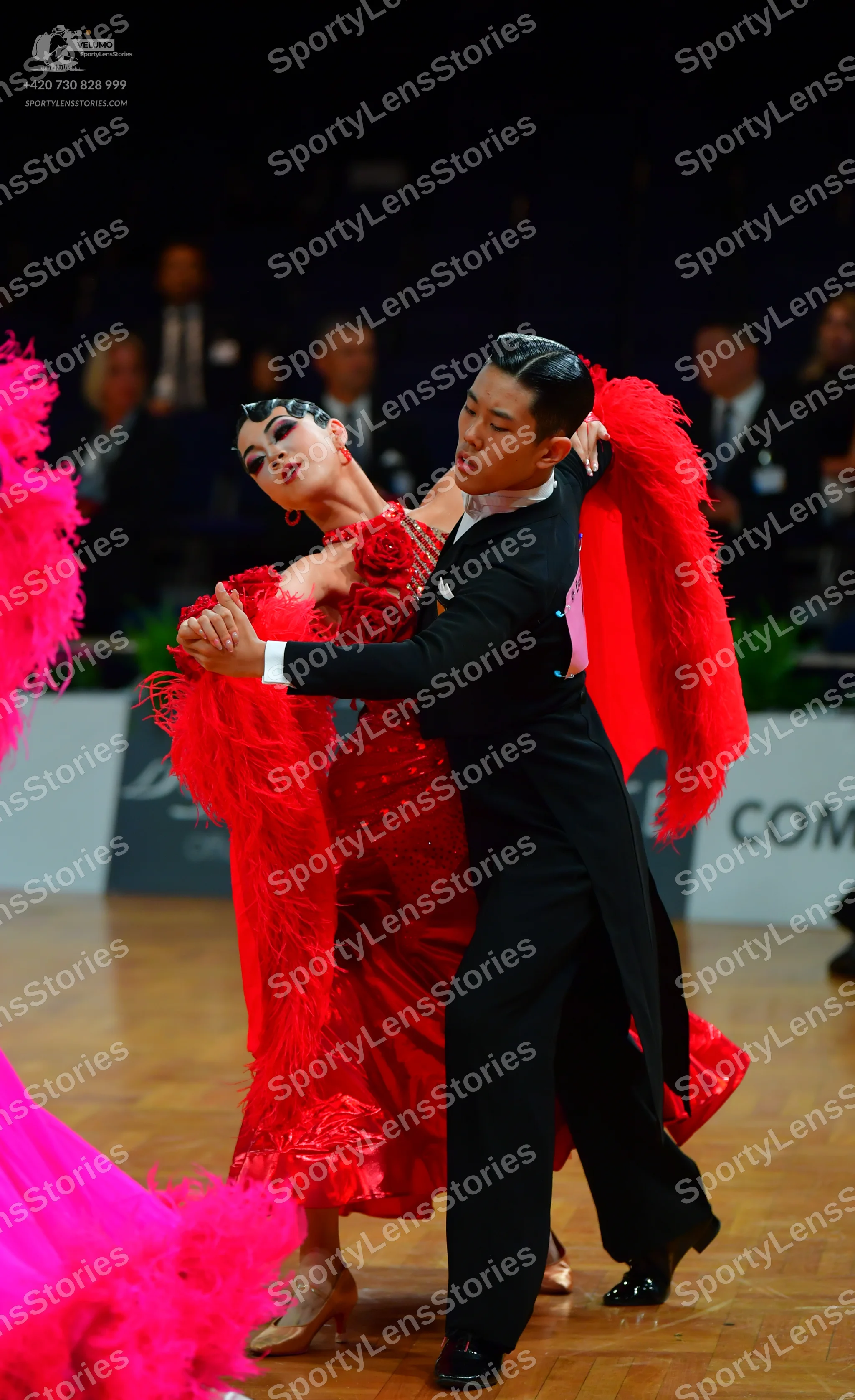 Dancesport competitor: Male dancer: black ballroom tailcoat, white shirt, black trousers, and black pat