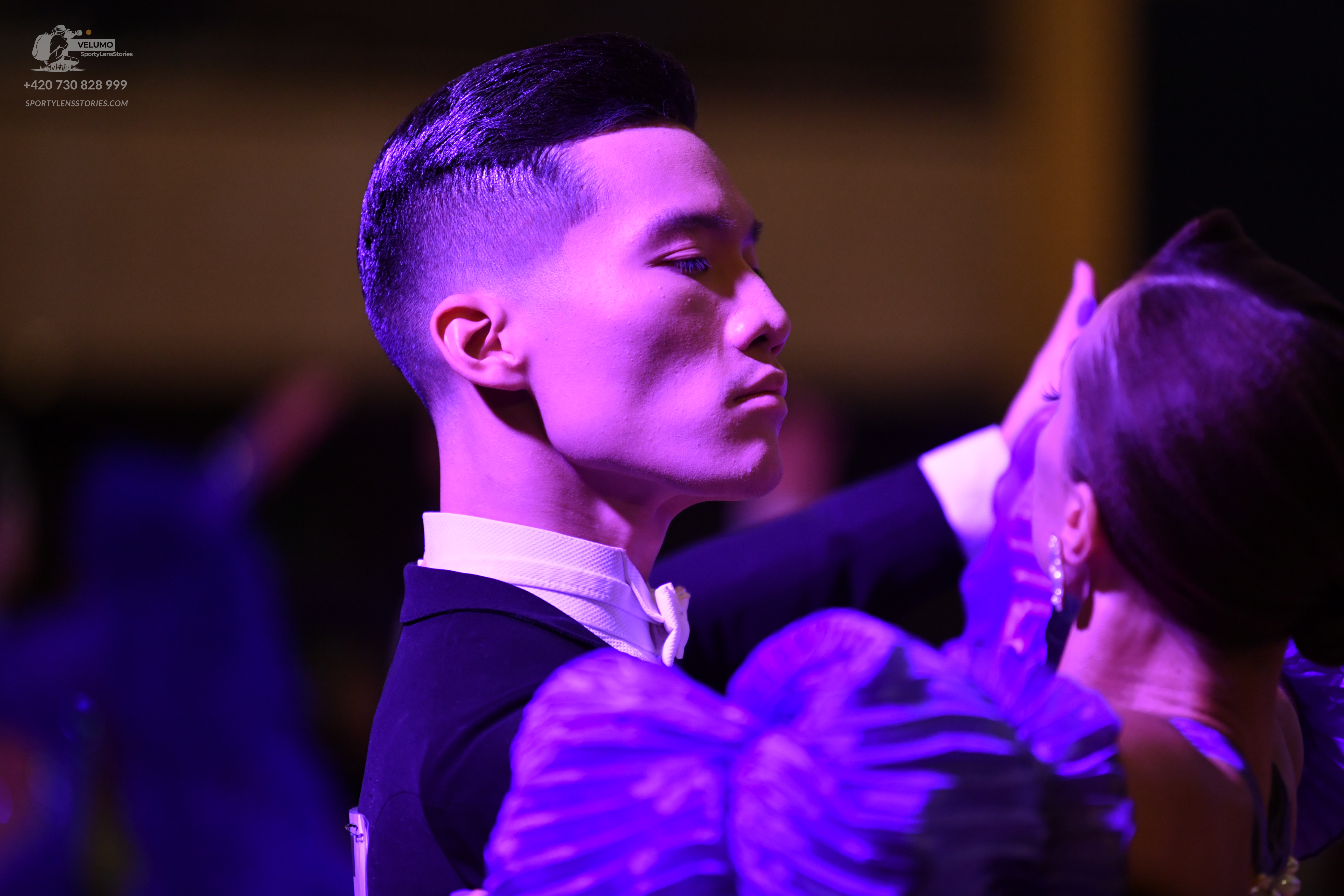 Dancesport competitor: Male dancer: black suit with a white shirt