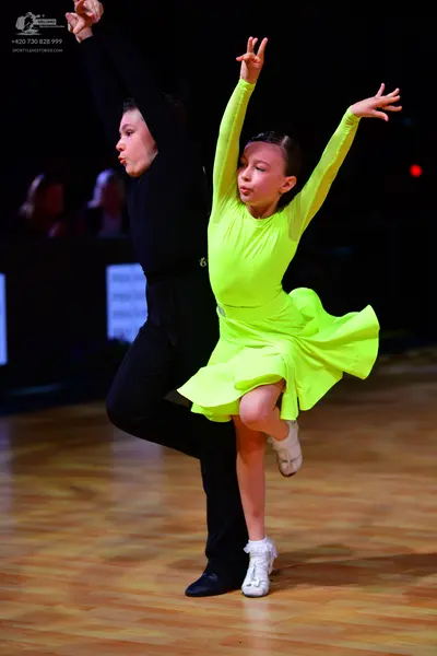 Dancesport competitor: Male dancer: black long-sleeved top and black trousers