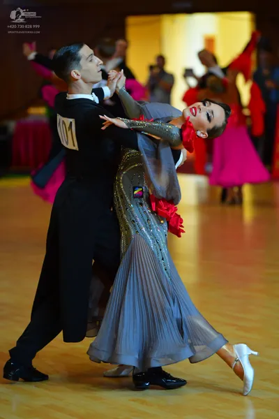 Dancesport competitor #101: Male dancer: black long-sleeved shirt and black trousers
