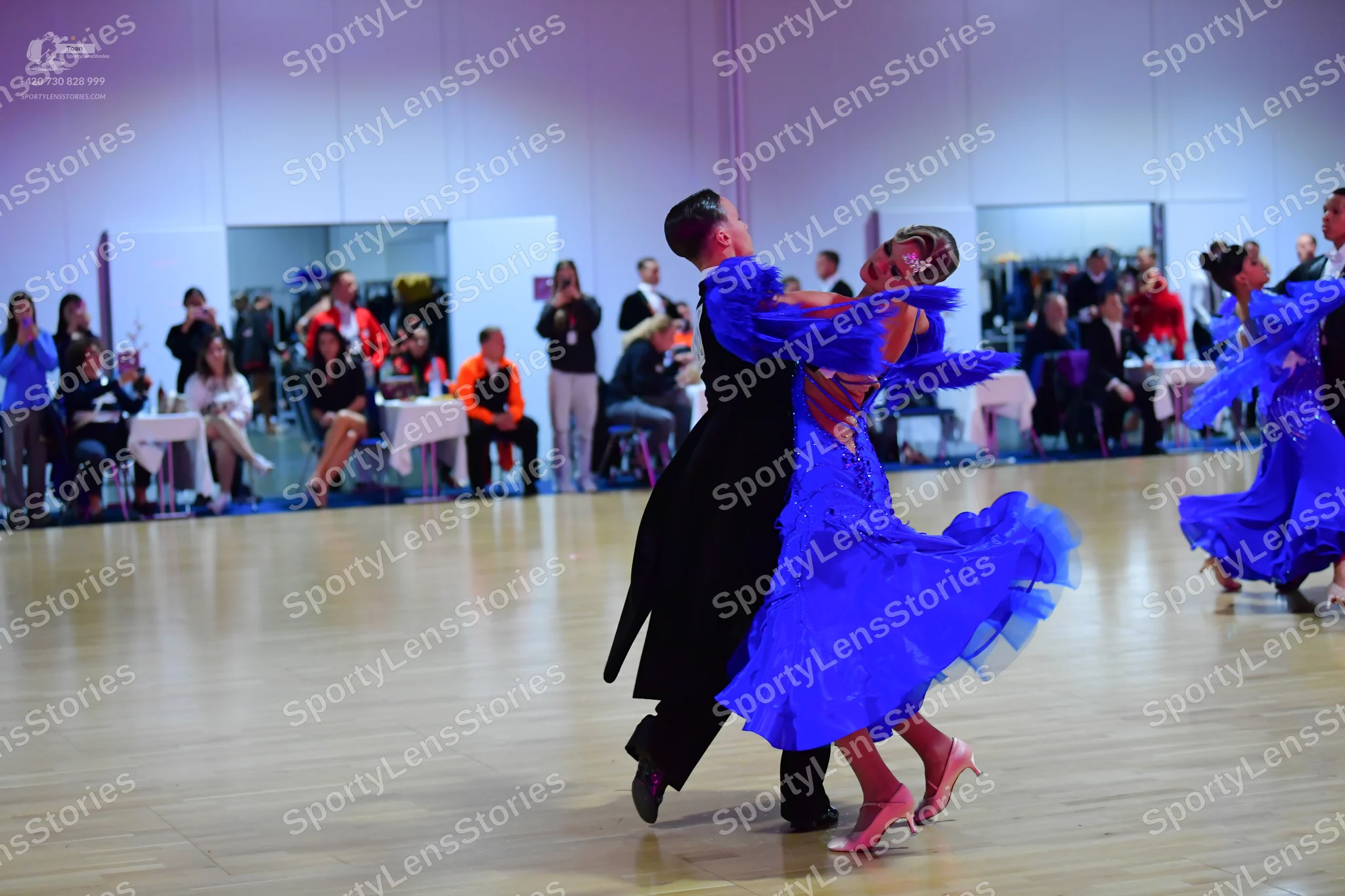 Dancesport competitor: Male dancer: black suit
