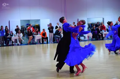 Dancesport competitor: Male dancer: black suit