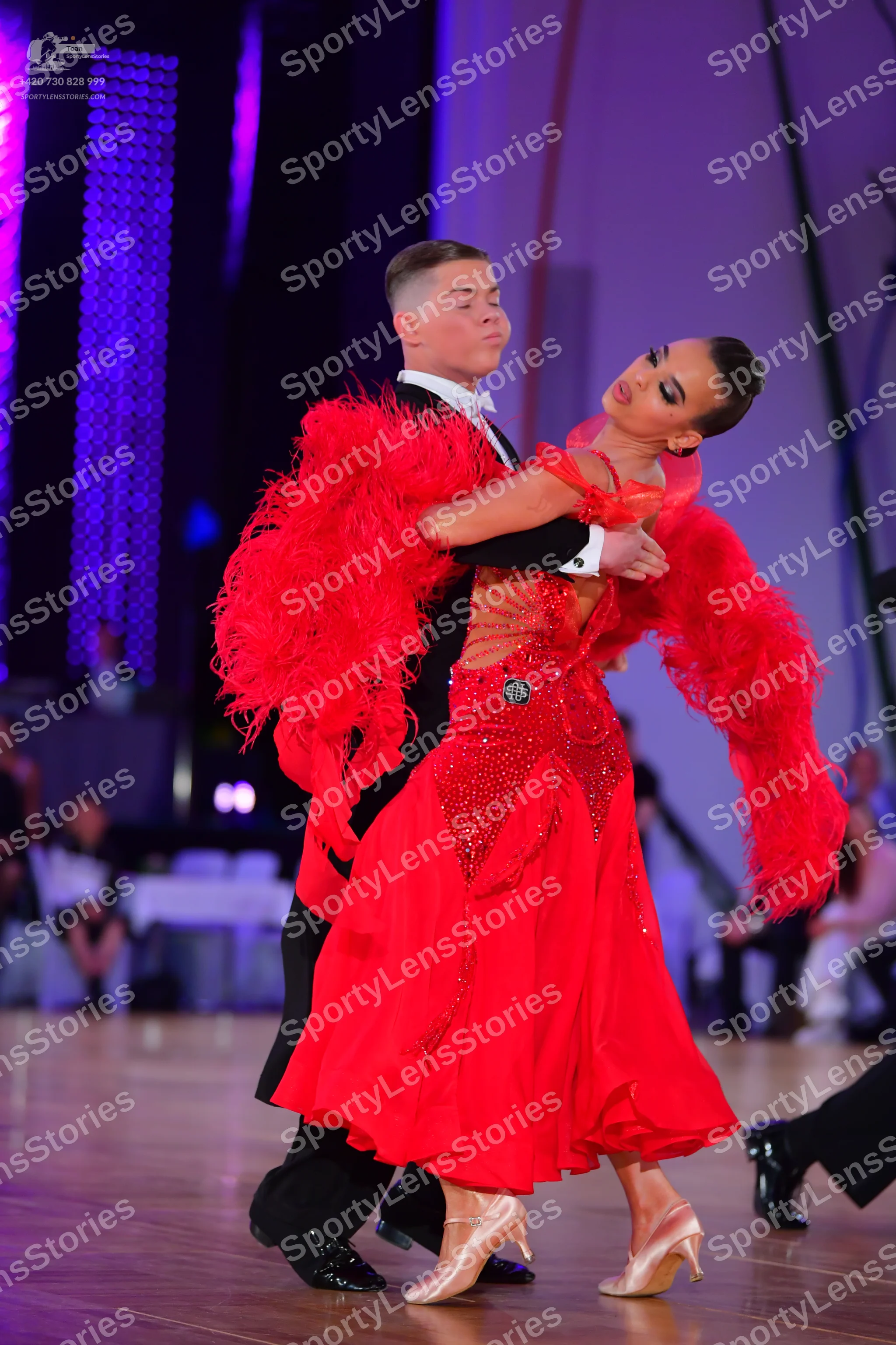 Dancesport competitor: Male dancer: black suit with a white shirt and white bowtie
