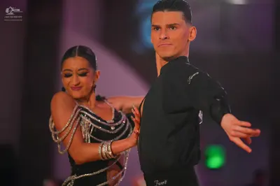 Dancesport competitor: Male dancer: black long-sleeved shirt