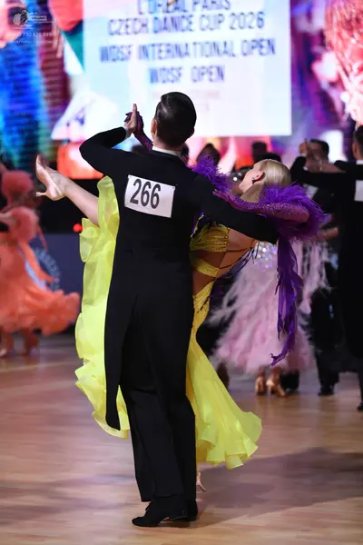 Dancesport competitor: Male dancer: black suit