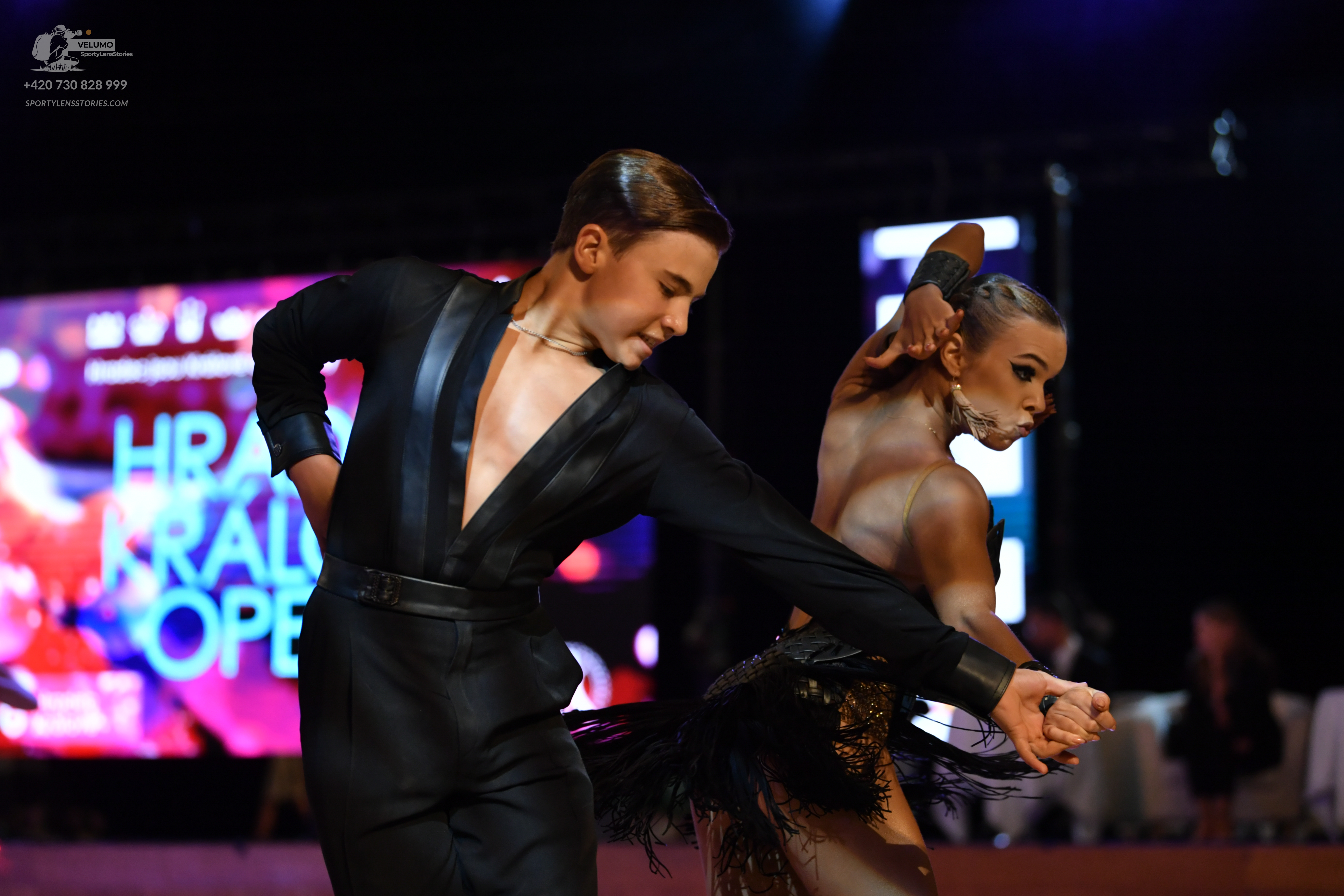 Dancesport competitor: Male:** Black suit with sequin lapels and black trousers