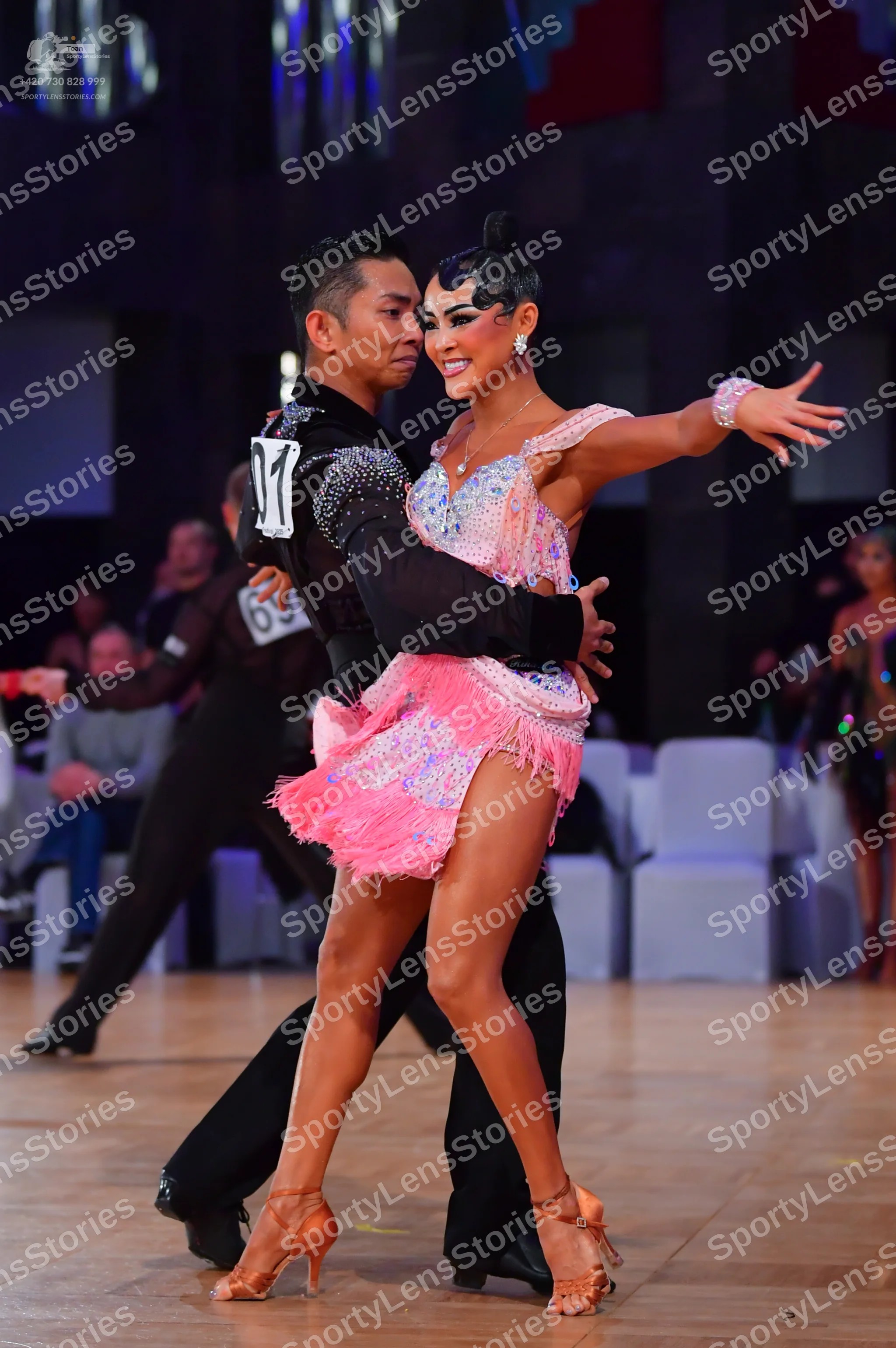Dancesport competitor #69: Male dancer: black long-sleeved top with sequined shoulder details and black tro