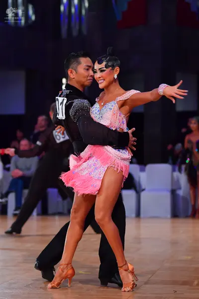 Dancesport competitor #69: Male dancer: black long-sleeved top with sequined shoulder details and black tro