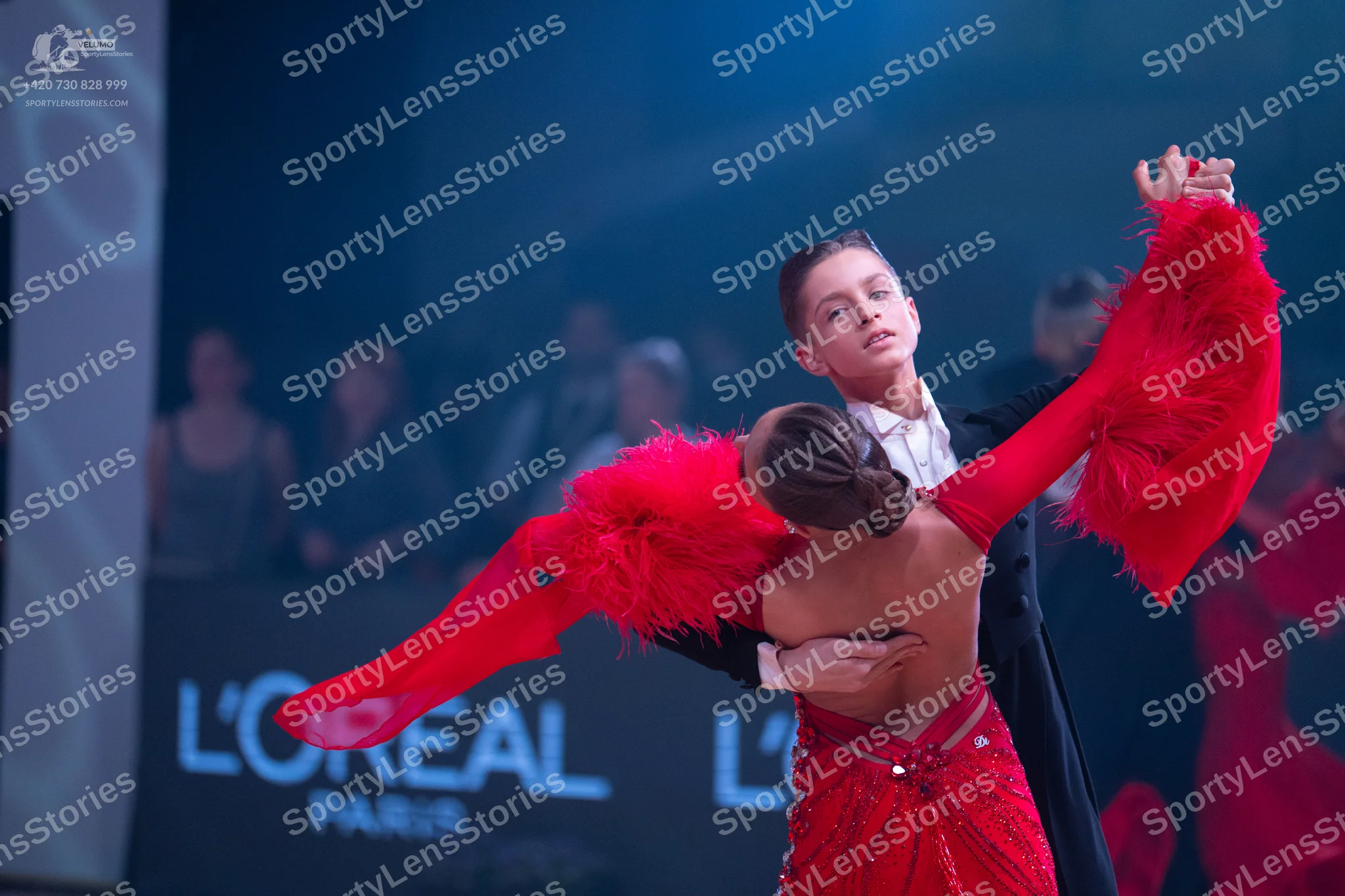 Dancesport competitor: Male dancer: black suit with a white shirt