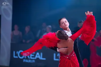 Dancesport competitor: Male dancer: black suit with a white shirt