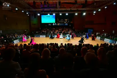 Dancesport competitor: Female dancers: various ballroom gowns in colors including magenta, white, light