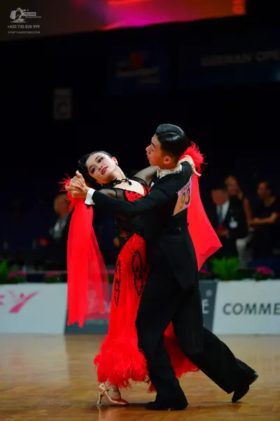 Dancesport competitor: Male dancer: black suit