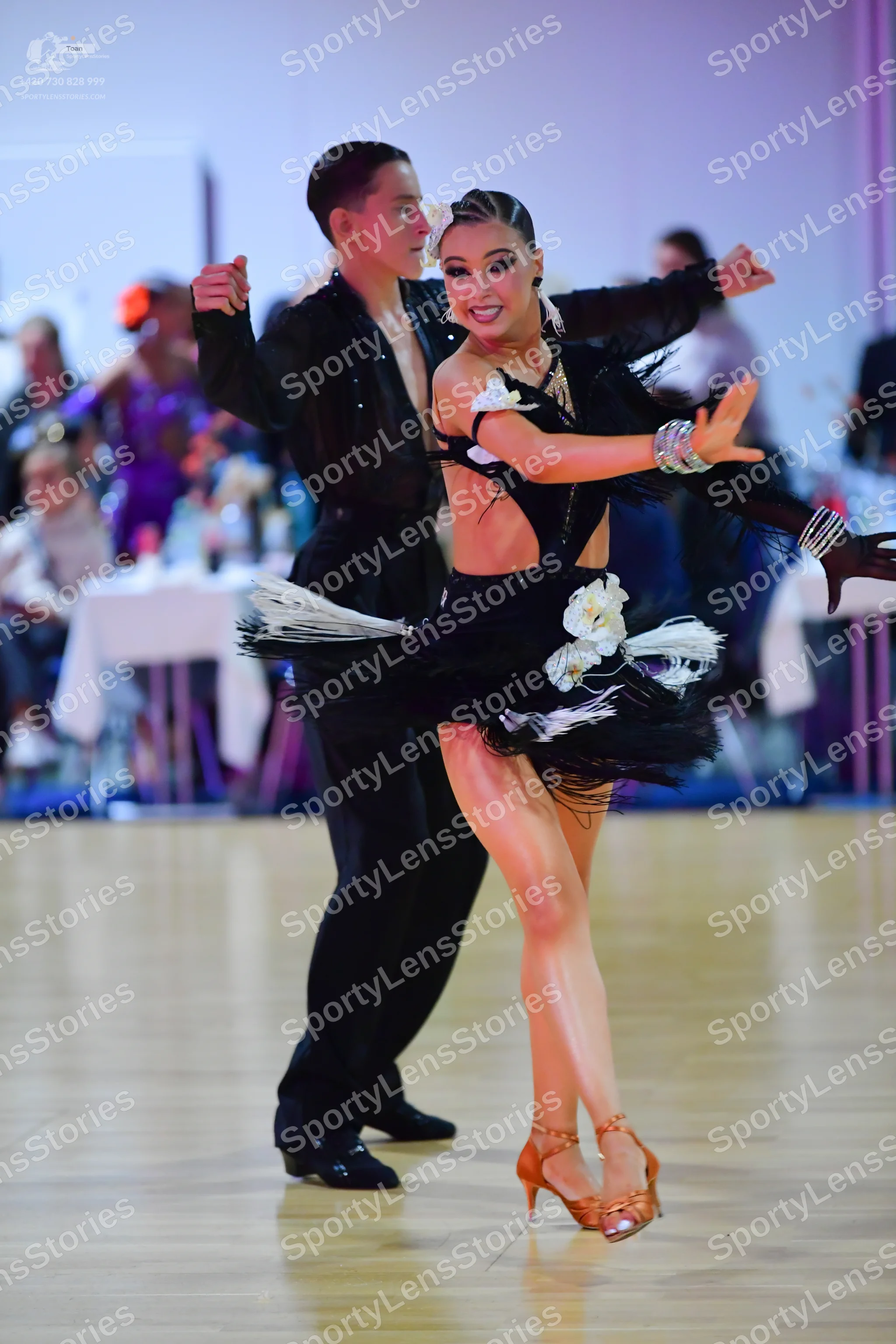 Dancesport competitor: Male dancer: black Latin dance outfit consisting of a shirt and trousers
