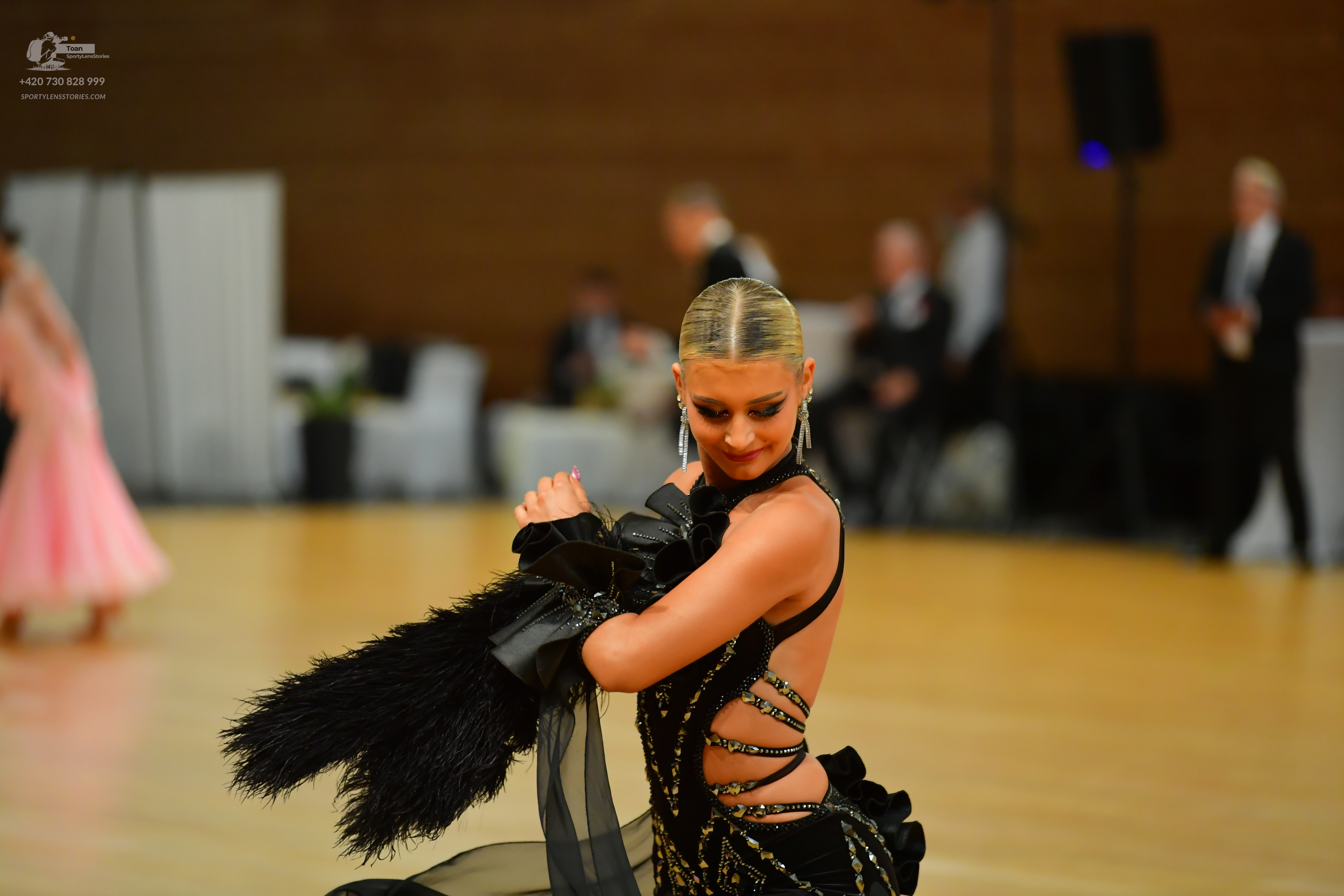 Dancesport competitor: ** Black Latin Dress 878 999
*   **Color:** Predominantly black with silver/grey
