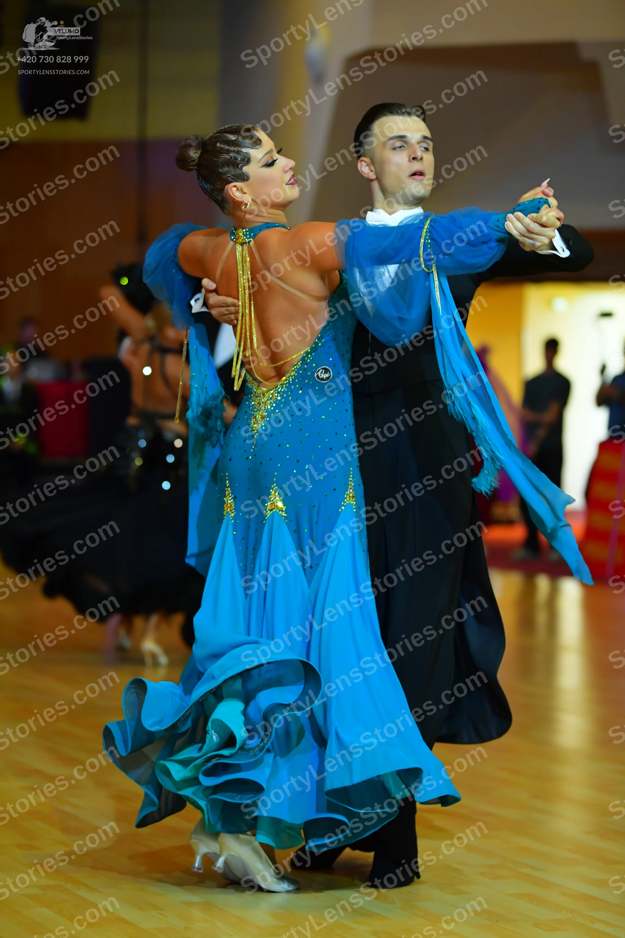 Dancesport competitor: Male dancer: black tailcoat suit with a white shirt
