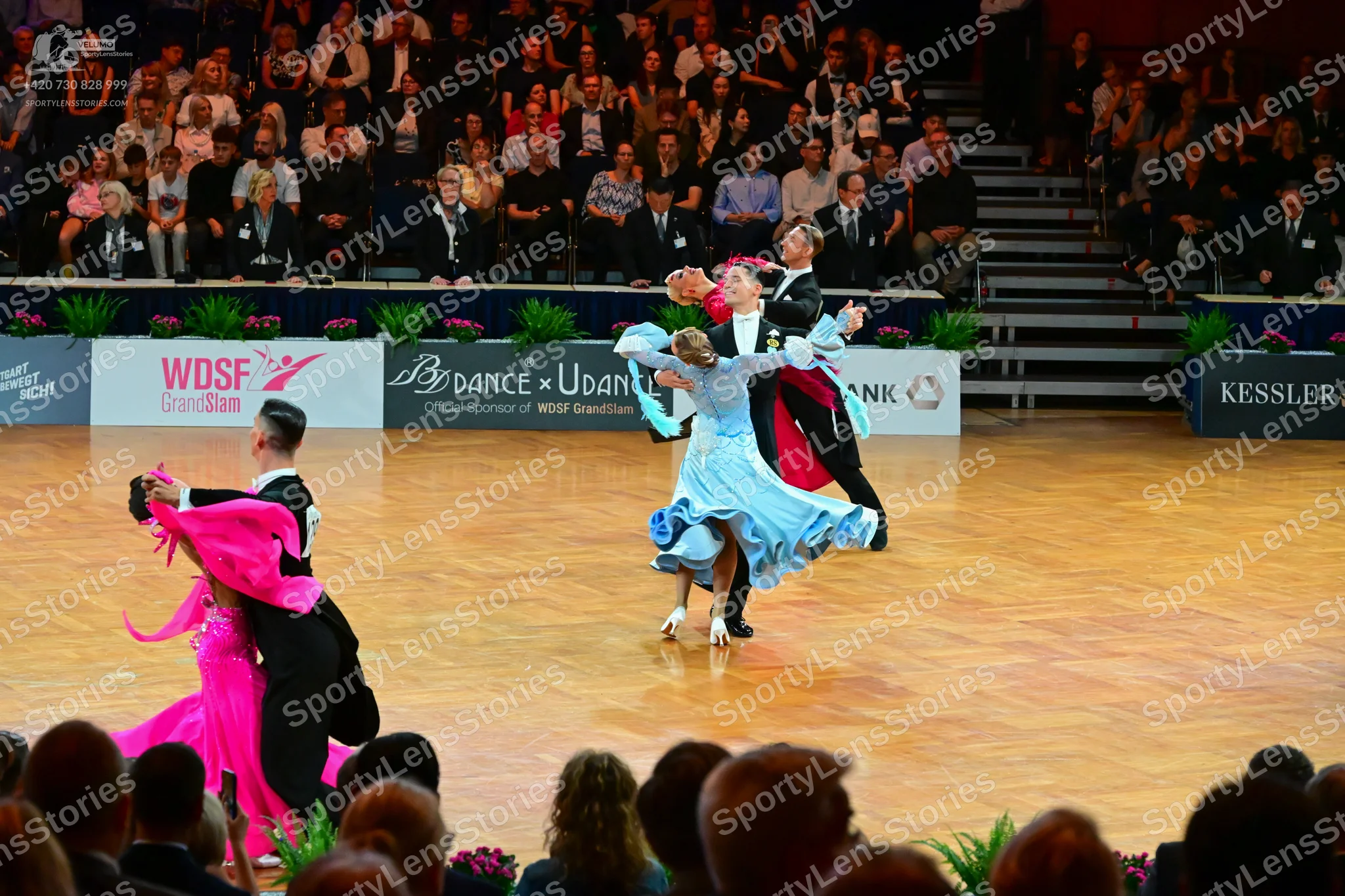 Dancesport competitor: Male dancer (left): black suit with a white shirt and black bow tie