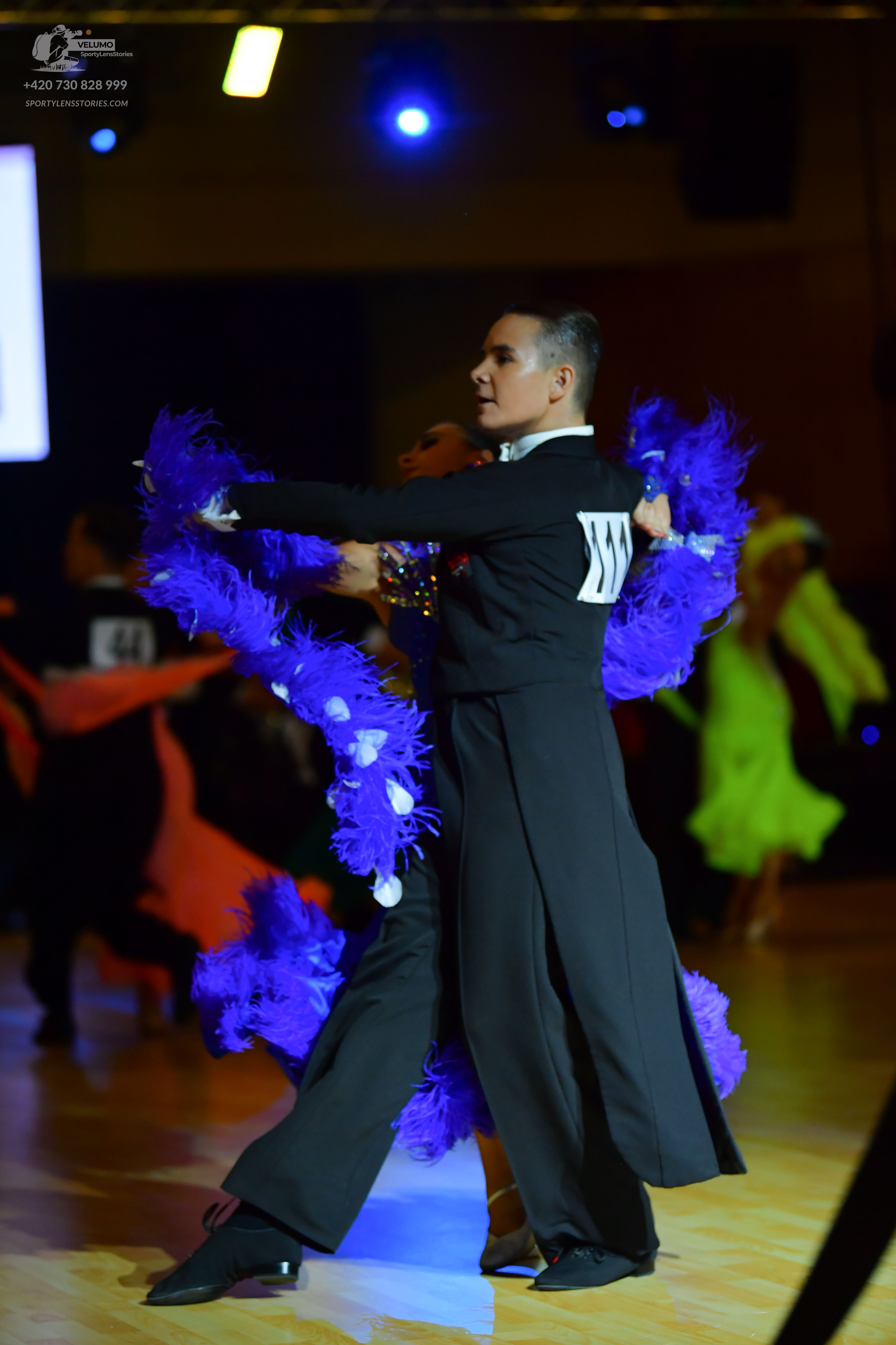 Dancesport competitor #44: Male dancer: black suit with white stripes on the sleeve
