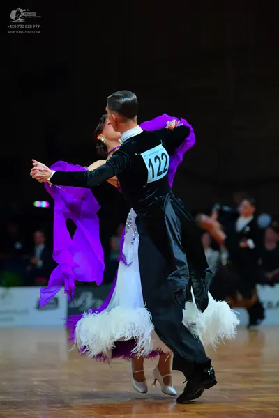 Dancesport competitor #122: Male dancer: black long-sleeved top and black trousers
