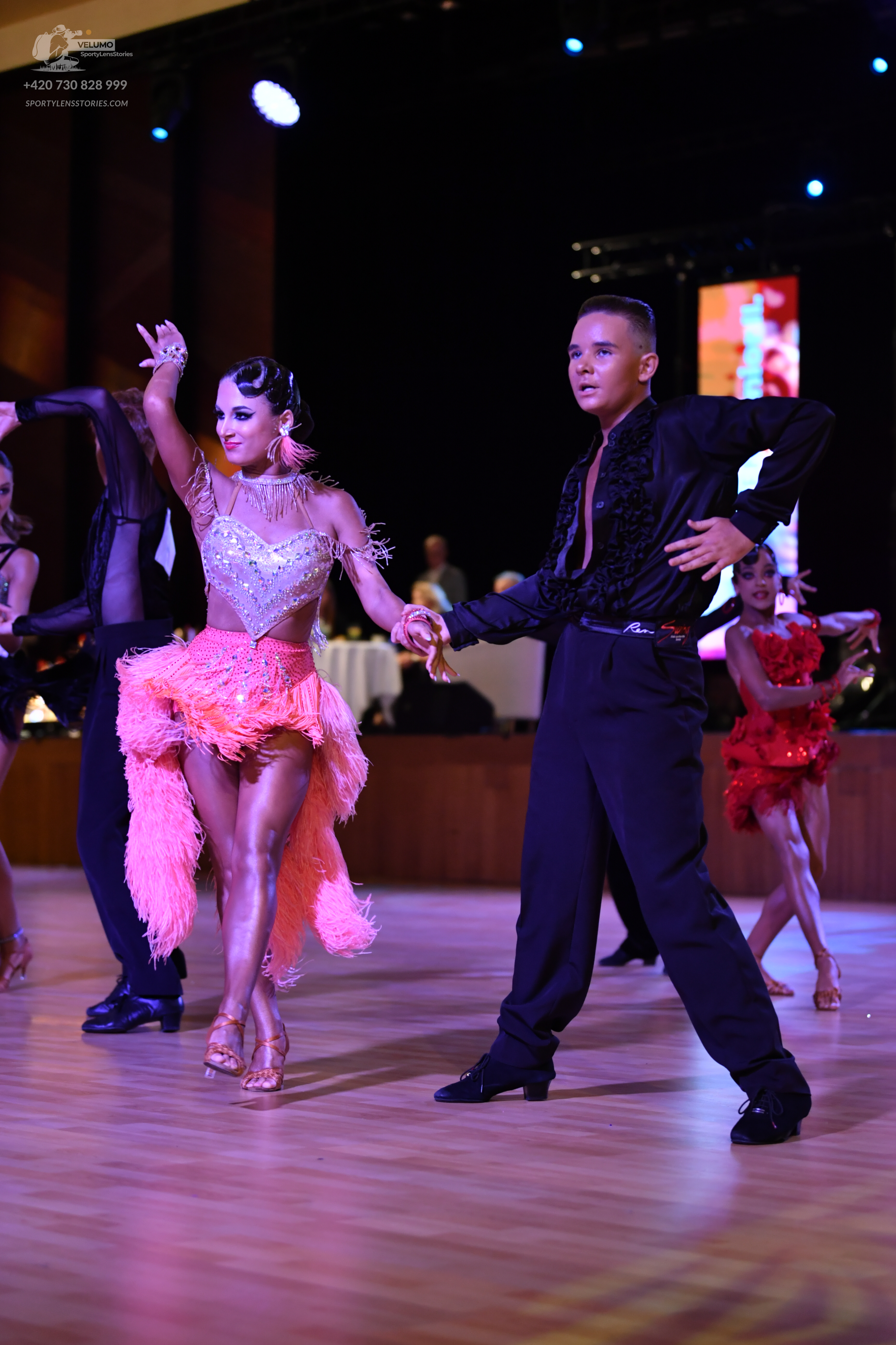 Dancesport competitor: ** Black suit with a satin or satin-like material