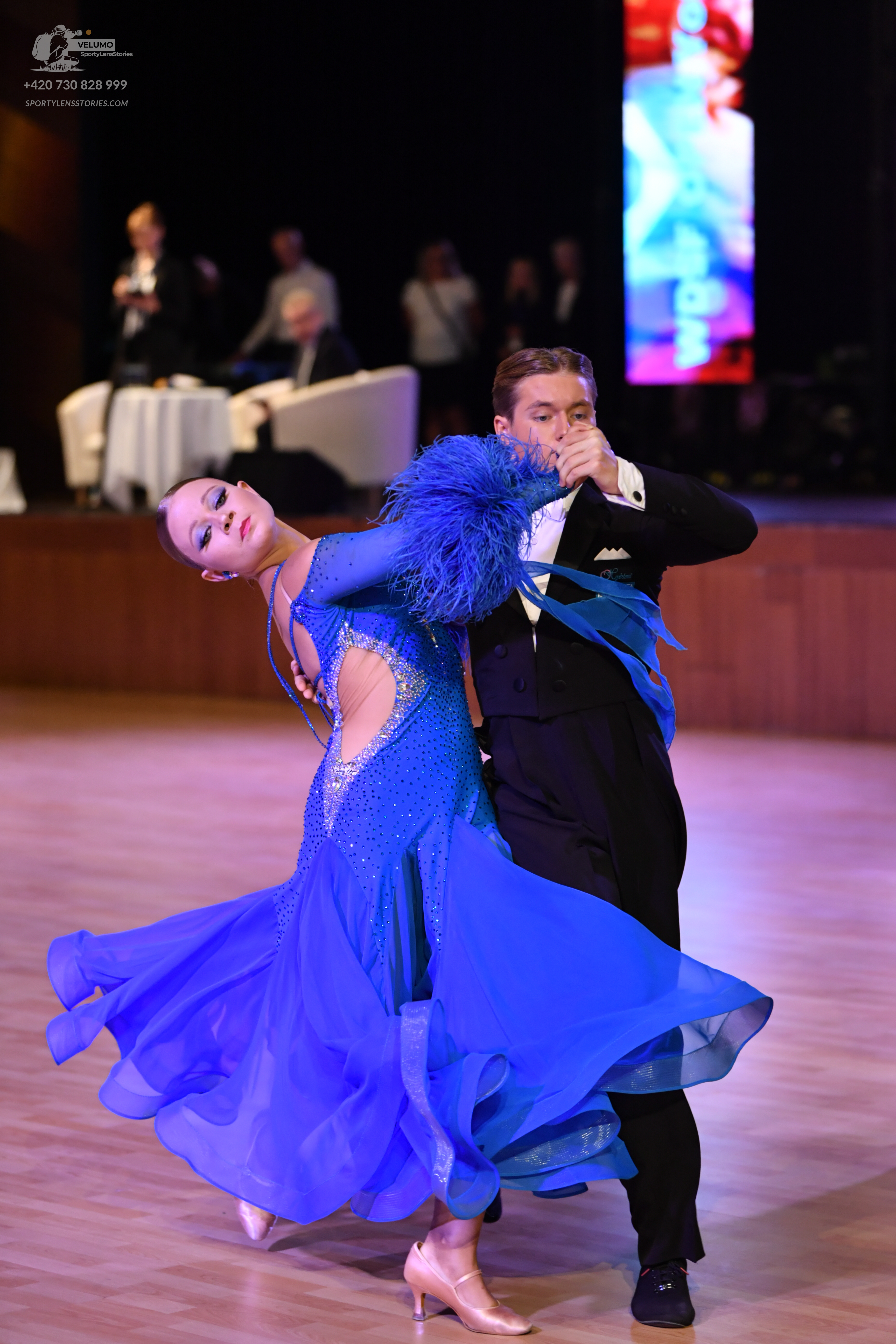 Dancesport competitor: Male:** Black tailsuit with silver/white sequin lapels and a shimmering effect