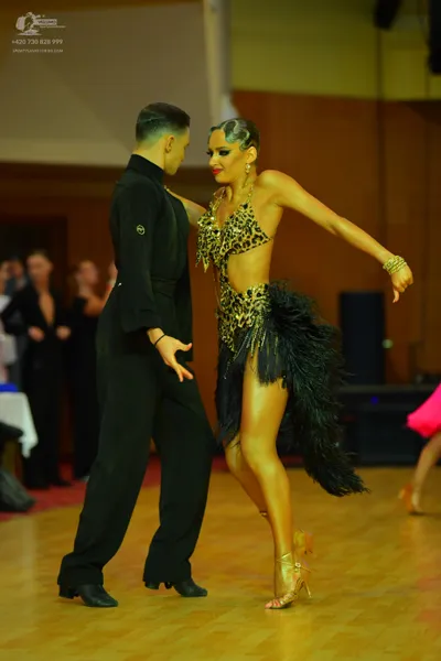 Dancesport competitor: Male dancer: black long-sleeved shirt and black trousers