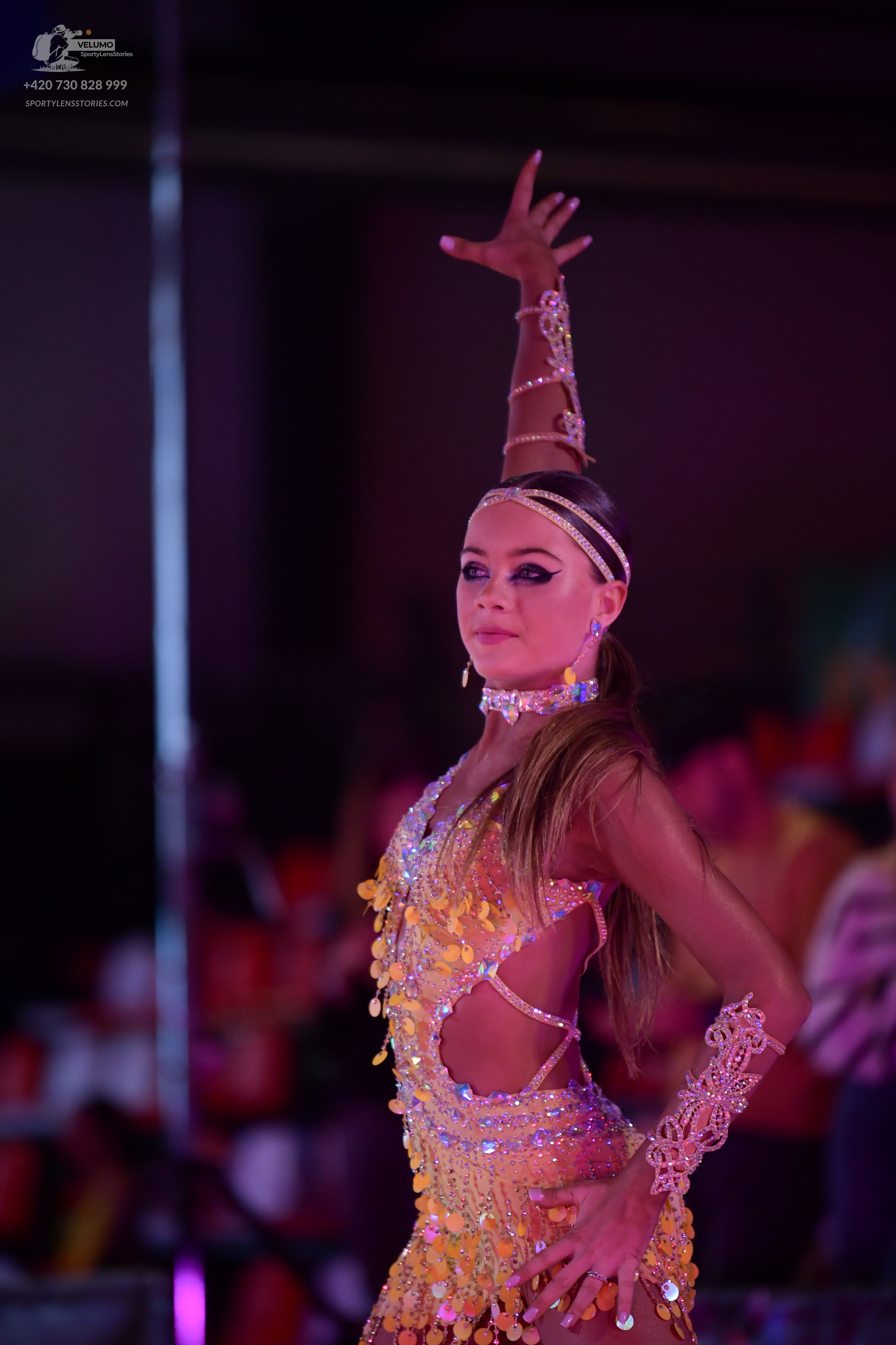 Dancesport competitor: Female dancer: yellow/gold latin dress with sequins and fringe/paillettes, featu